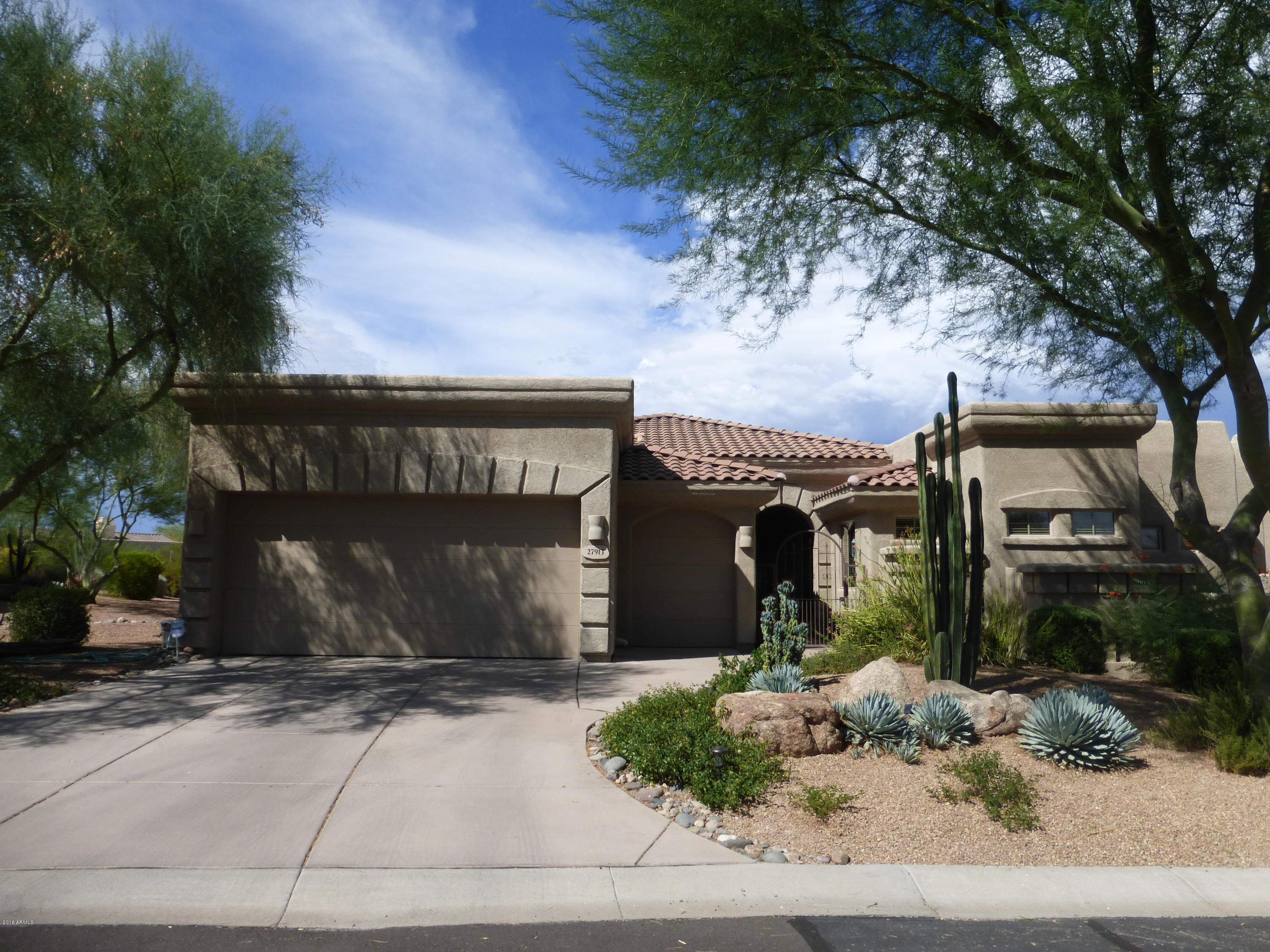 27913 North Quail Spring Road Rio Verde, AZ 85263 - Photo 3 of 63 a front view of a house with garden