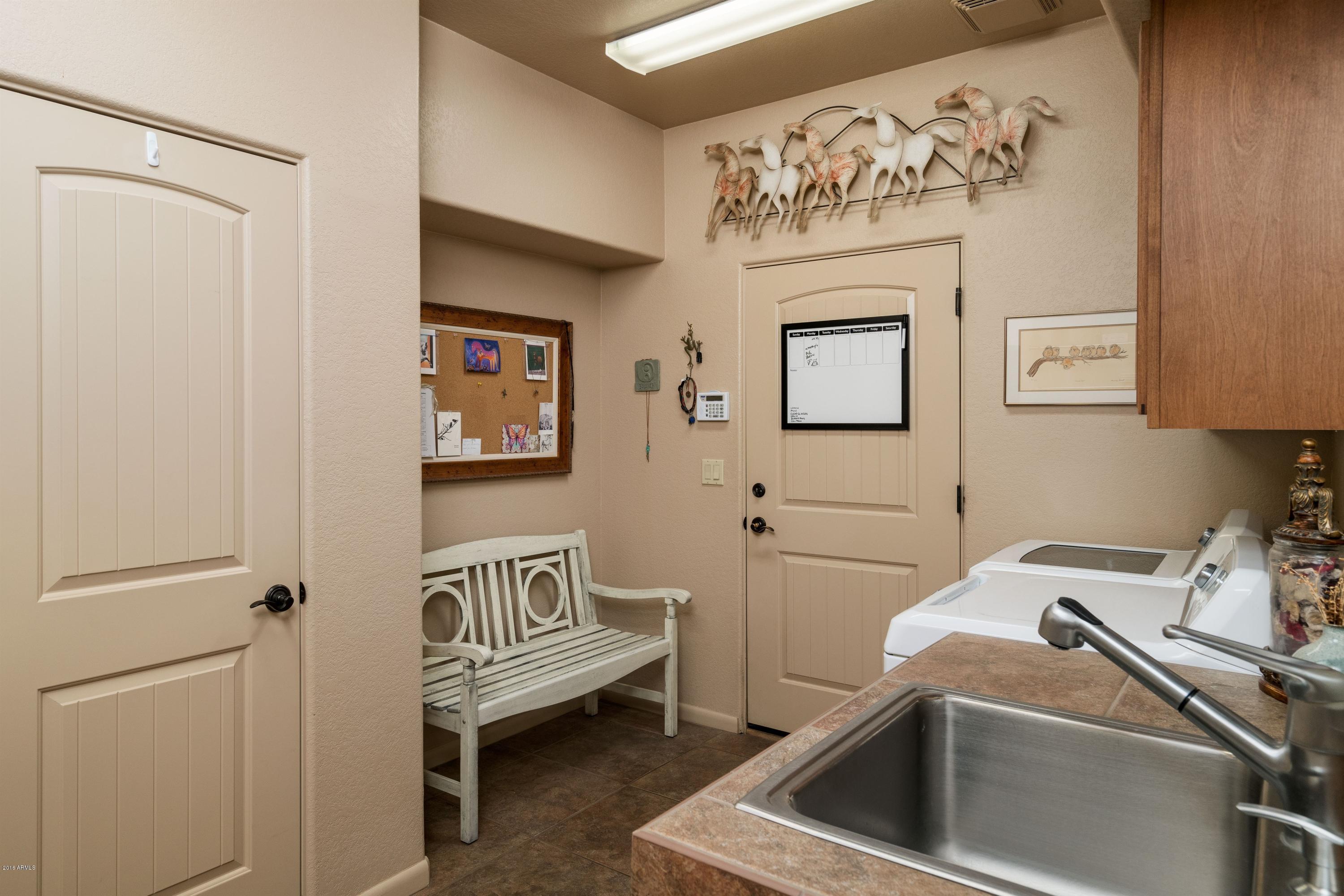 27913 North Quail Spring Road Rio Verde, AZ 85263 - Photo 36 of 63 a bathroom with a sink and a toilet
