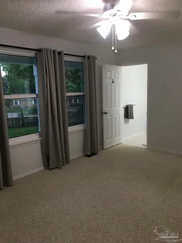 a view of a room with a large window