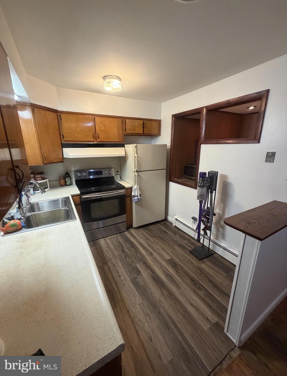 306 Gum Tree Road Coatesville, PA 19320 - Photo 3 of 15 a kitchen with a sink appliances and cabinets