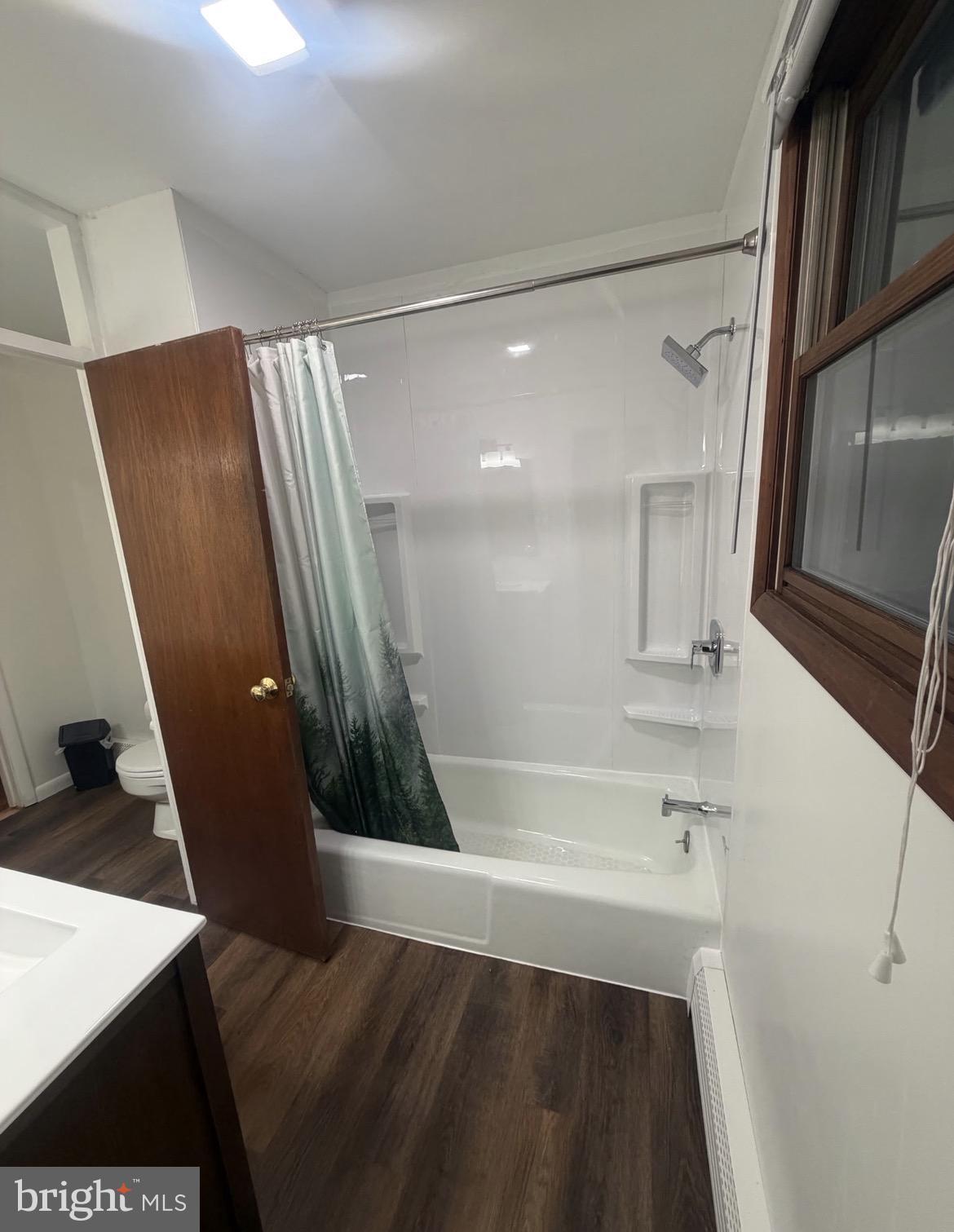 306 Gum Tree Road Coatesville, PA 19320 - Photo 9 of 15 a bathroom with a sink a toilet a tub and a mirror