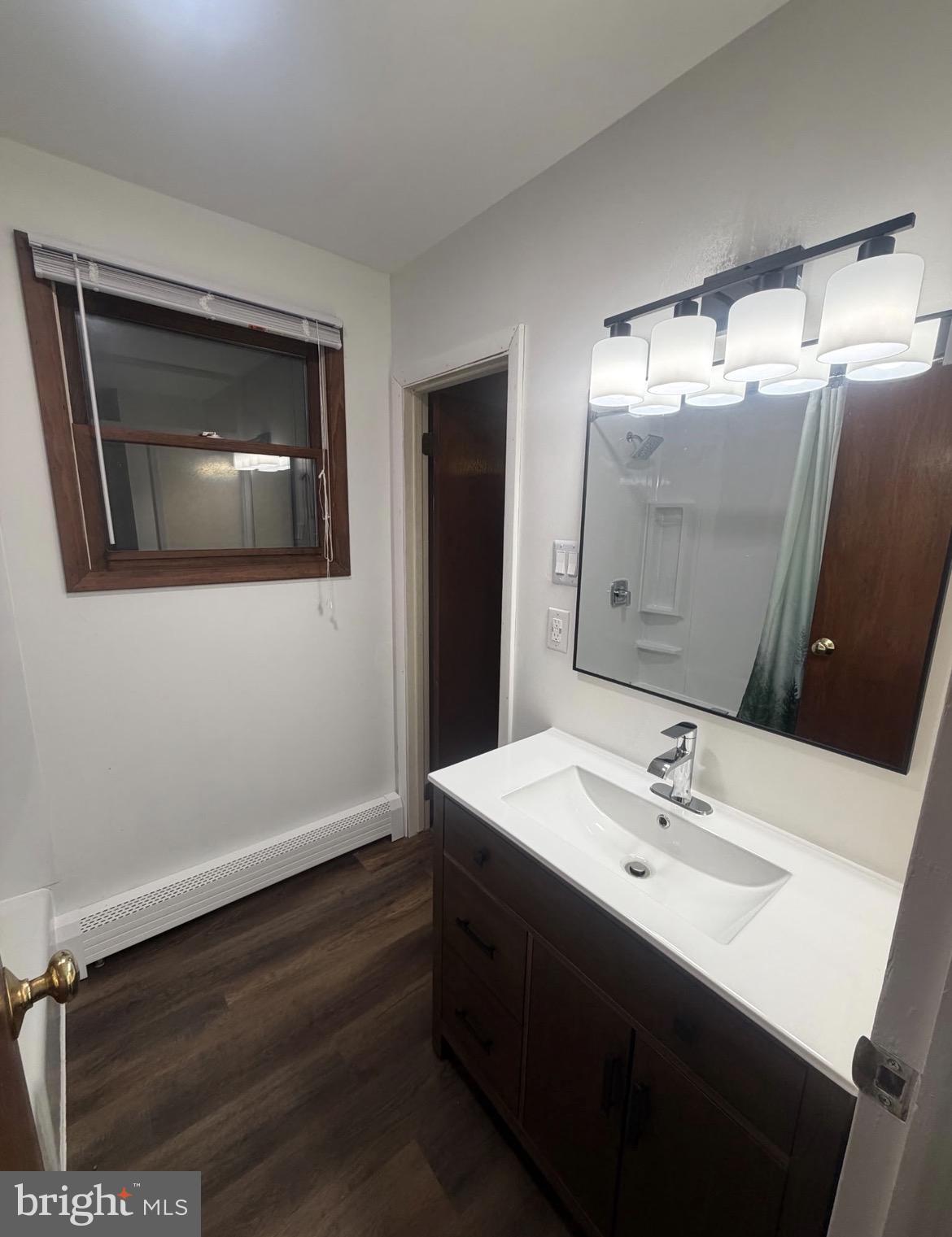 306 Gum Tree Road Coatesville, PA 19320 - Photo 10 of 15 a bathroom with a sink and a mirror