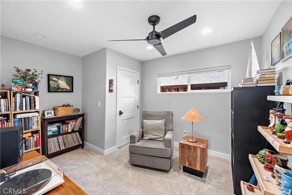 130 West Mariposa San Clemente, CA 92672 - Photo 14 of 42 a living room with furniture and a book shelf