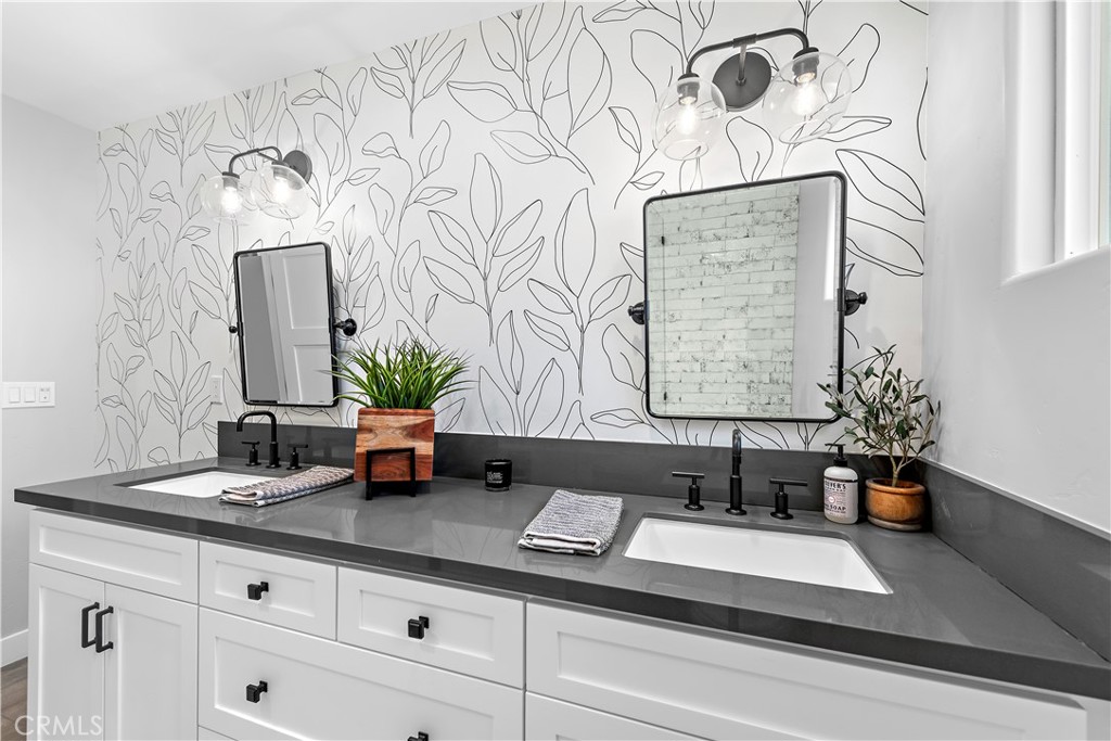 130 West Mariposa San Clemente, CA 92672 - Photo 16 of 42 a bath room with a sink and a mirror