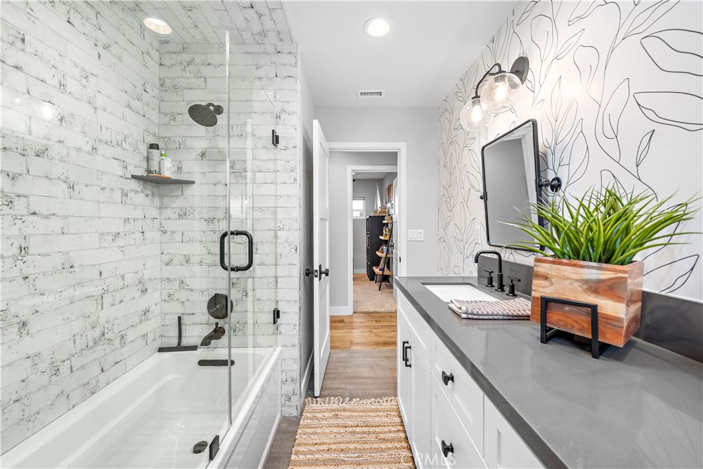 130 West Mariposa San Clemente, CA 92672 - Photo 17 of 42 a bathroom with a tub sink and mirror