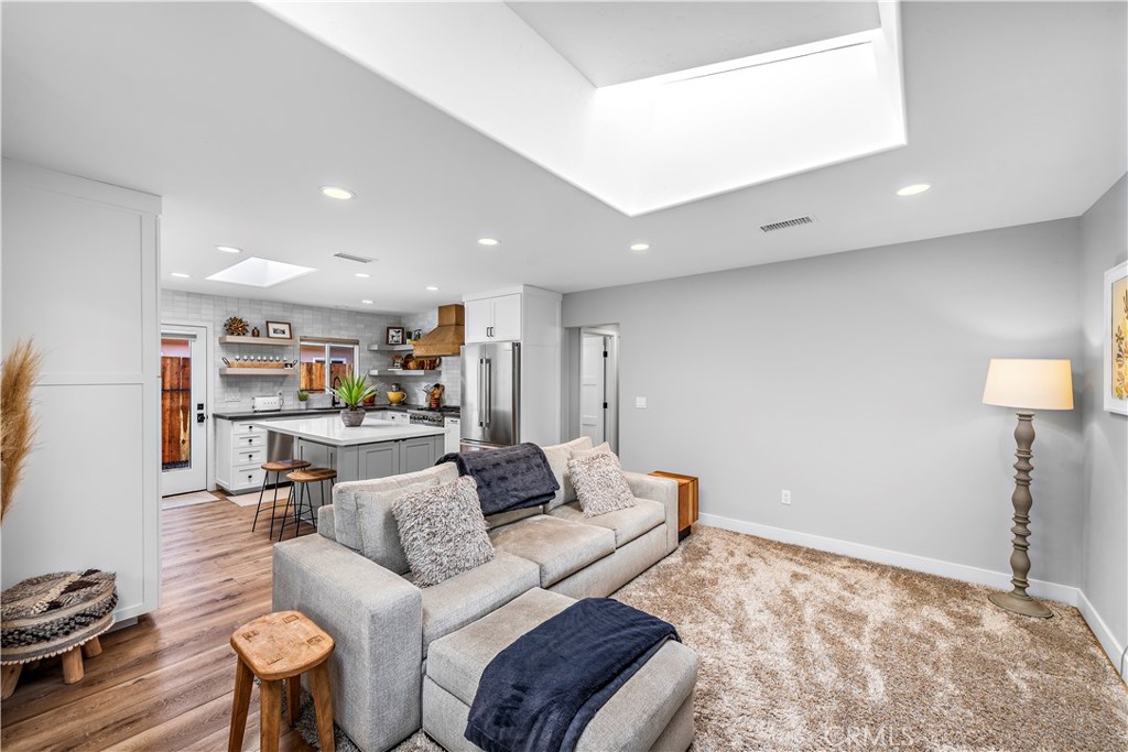 130 West Mariposa San Clemente, CA 92672 - Photo 6 of 42 a living room with furniture and a wooden floor
