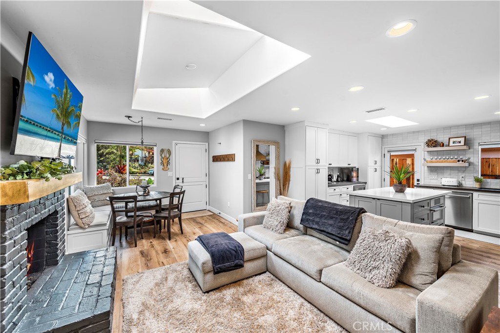 130 West Mariposa San Clemente, CA 92672 - Photo 7 of 42 a living room with furniture and a fireplace