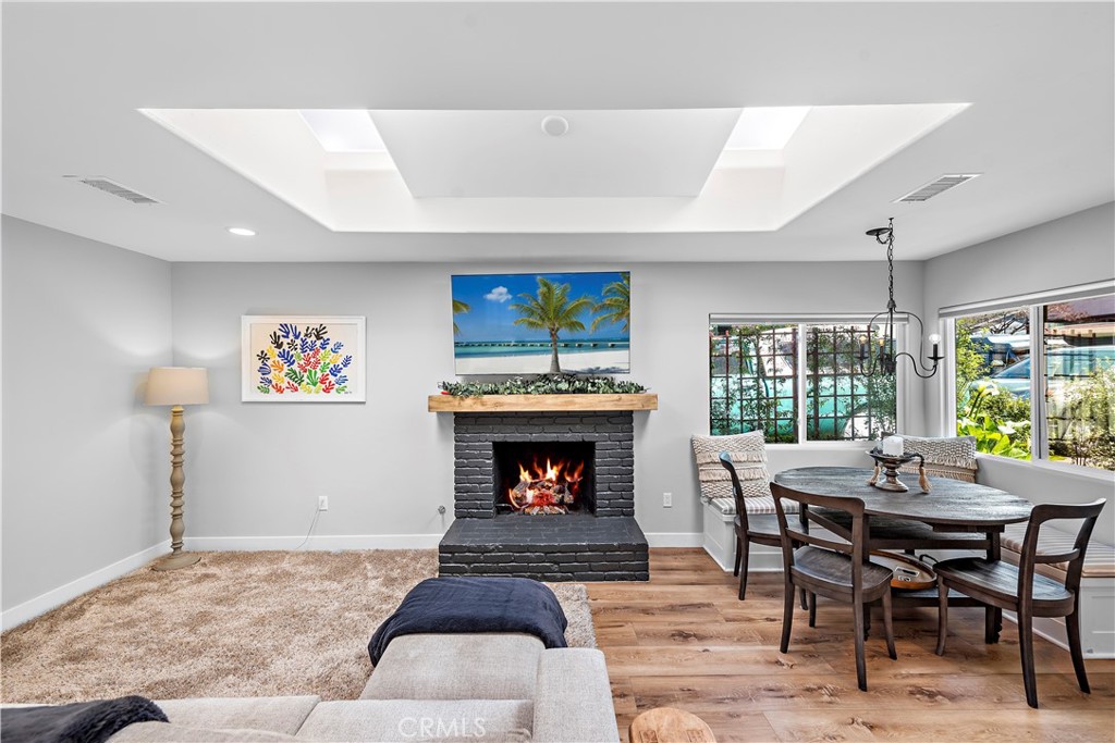130 West Mariposa San Clemente, CA 92672 - Photo 9 of 42 a living room with furniture and a fireplace