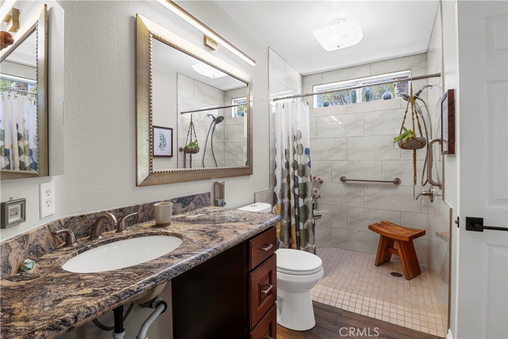 12786 North Rim Way Rancho Cucamonga, CA 91739 - Photo 21 of 50 a bathroom with a granite countertop sink toilet and shower