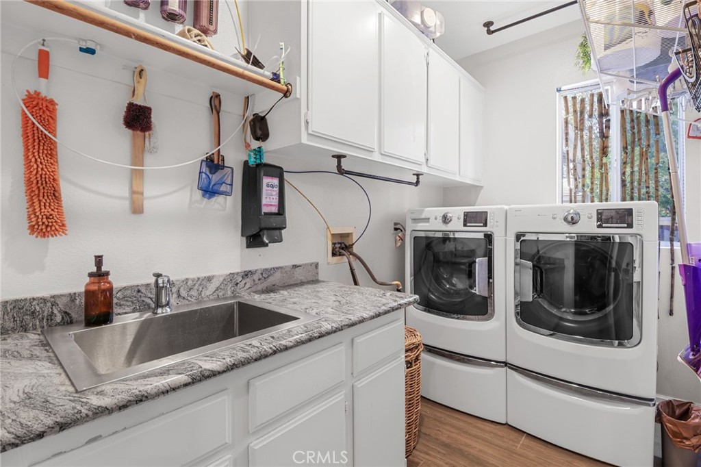 12786 North Rim Way Rancho Cucamonga, CA 91739 - Photo 22 of 50 a kitchen with stainless steel appliances granite countertop a sink and cabinets
