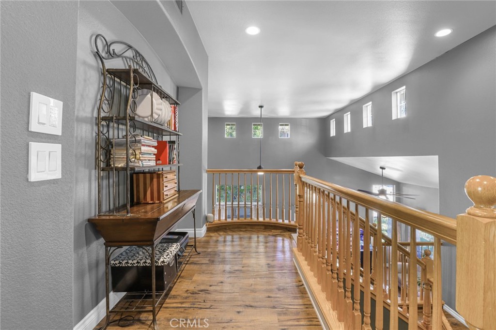 12786 North Rim Way Rancho Cucamonga, CA 91739 - Photo 25 of 50 a view of a hallway with furniture and stairs