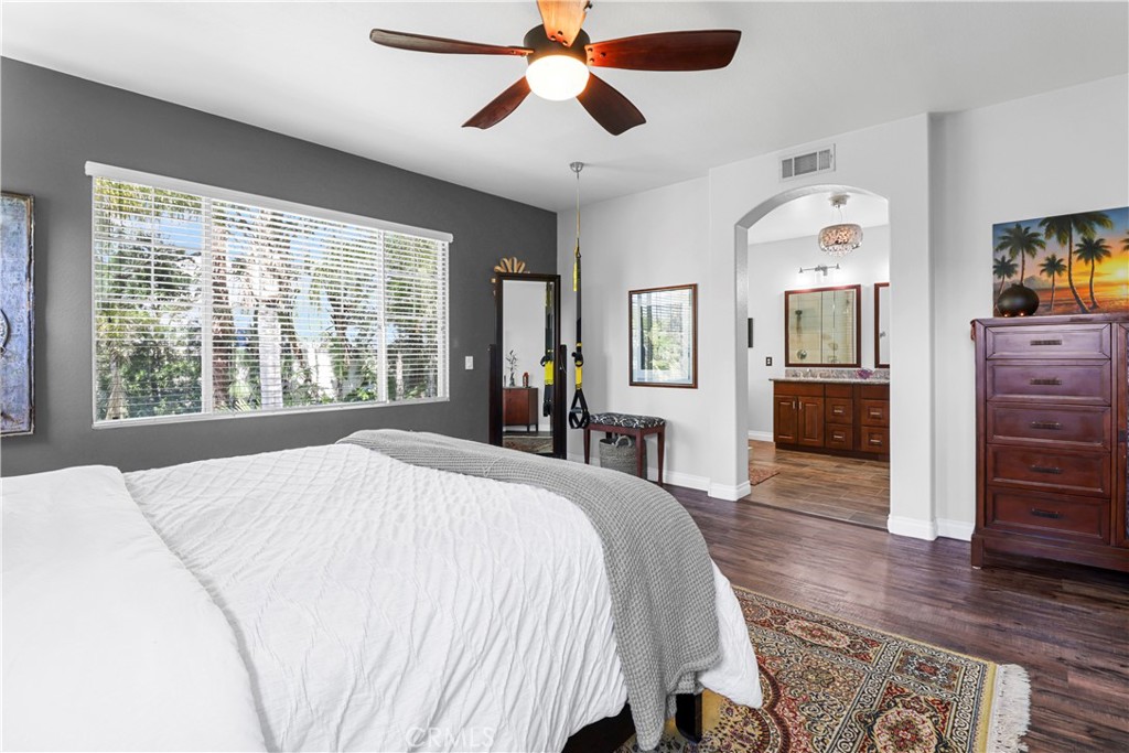 12786 North Rim Way Rancho Cucamonga, CA 91739 - Photo 27 of 50 a spacious bedroom with a large bed and a dresser