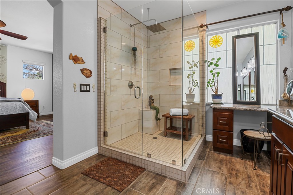 12786 North Rim Way Rancho Cucamonga, CA 91739 - Photo 30 of 50 a spacious bathroom with a glass shower door and a window