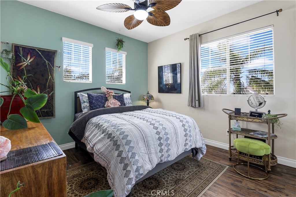 12786 North Rim Way Rancho Cucamonga, CA 91739 - Photo 34 of 50 a bedroom with a bed chairs and a window