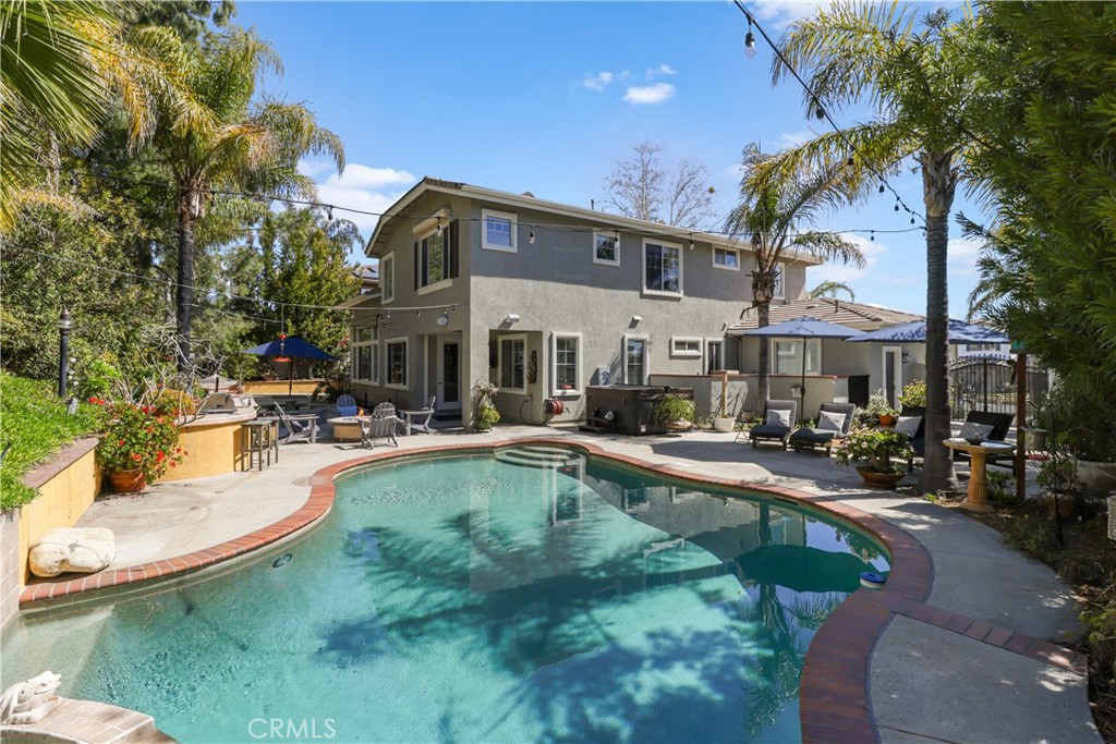 12786 North Rim Way Rancho Cucamonga, CA 91739 - Photo 42 of 50 a swimming pool with outdoor seating and yard