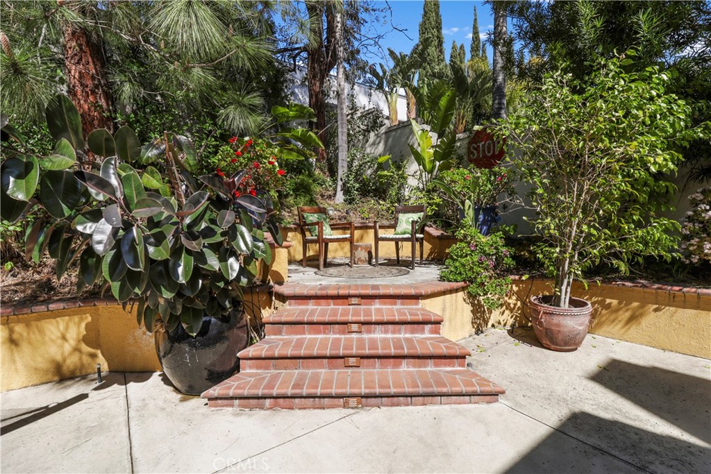 12786 North Rim Way Rancho Cucamonga, CA 91739 - Photo 45 of 50 a view of a patio with table and chairs and potted plants
