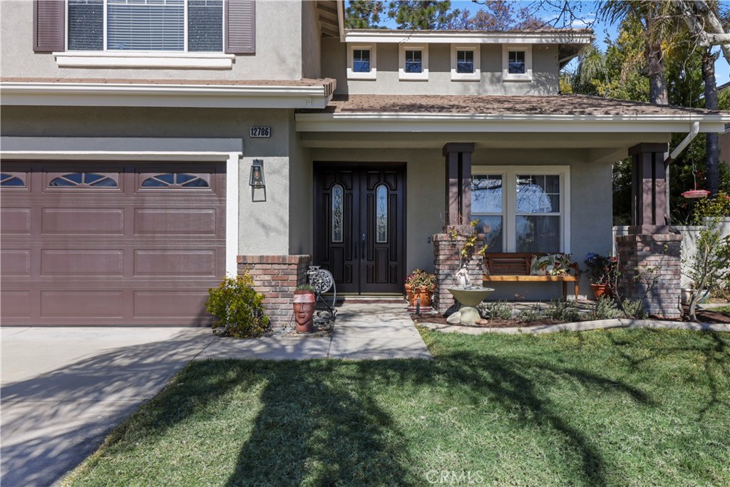 12786 North Rim Way Rancho Cucamonga, CA 91739 - Photo 6 of 50 a view of a house with small yard plants and large tree