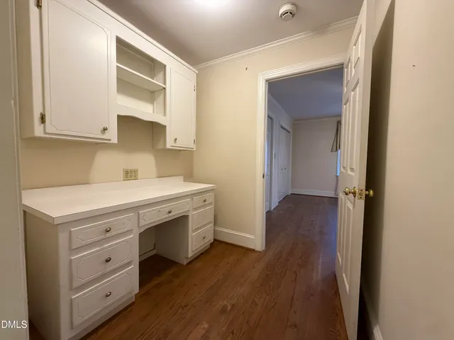 a view of cabinets and wooden floor