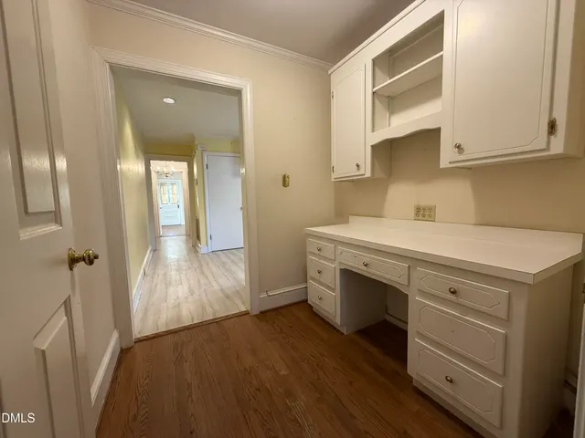 a view of cabinets and wooden floor