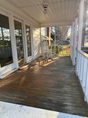 a view of an empty room with glass door