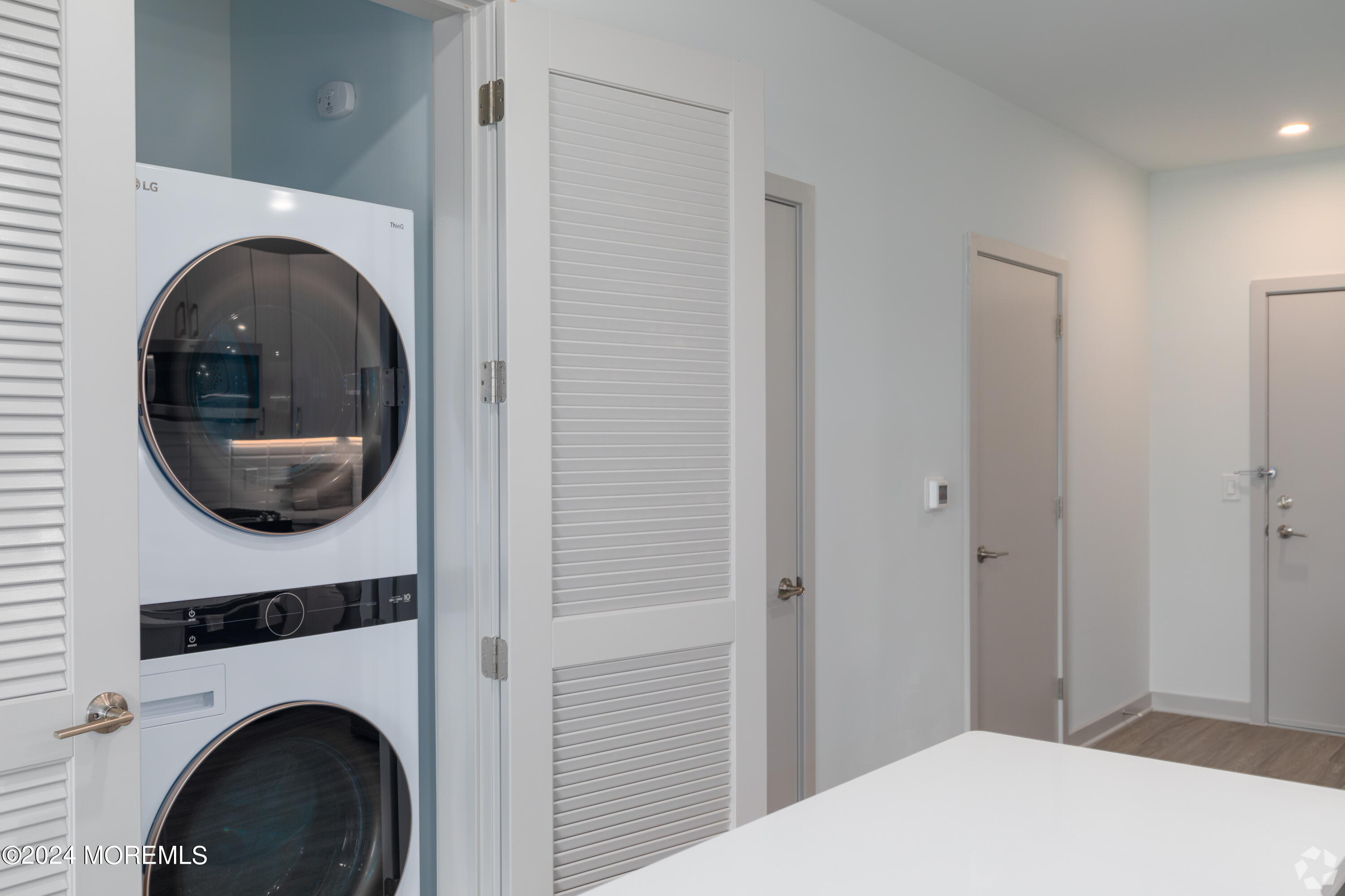 6461 Highway 9, Unit #134 Howell, NJ 07731 - Photo 13 of 21 a bedroom with a bed and a washing machine