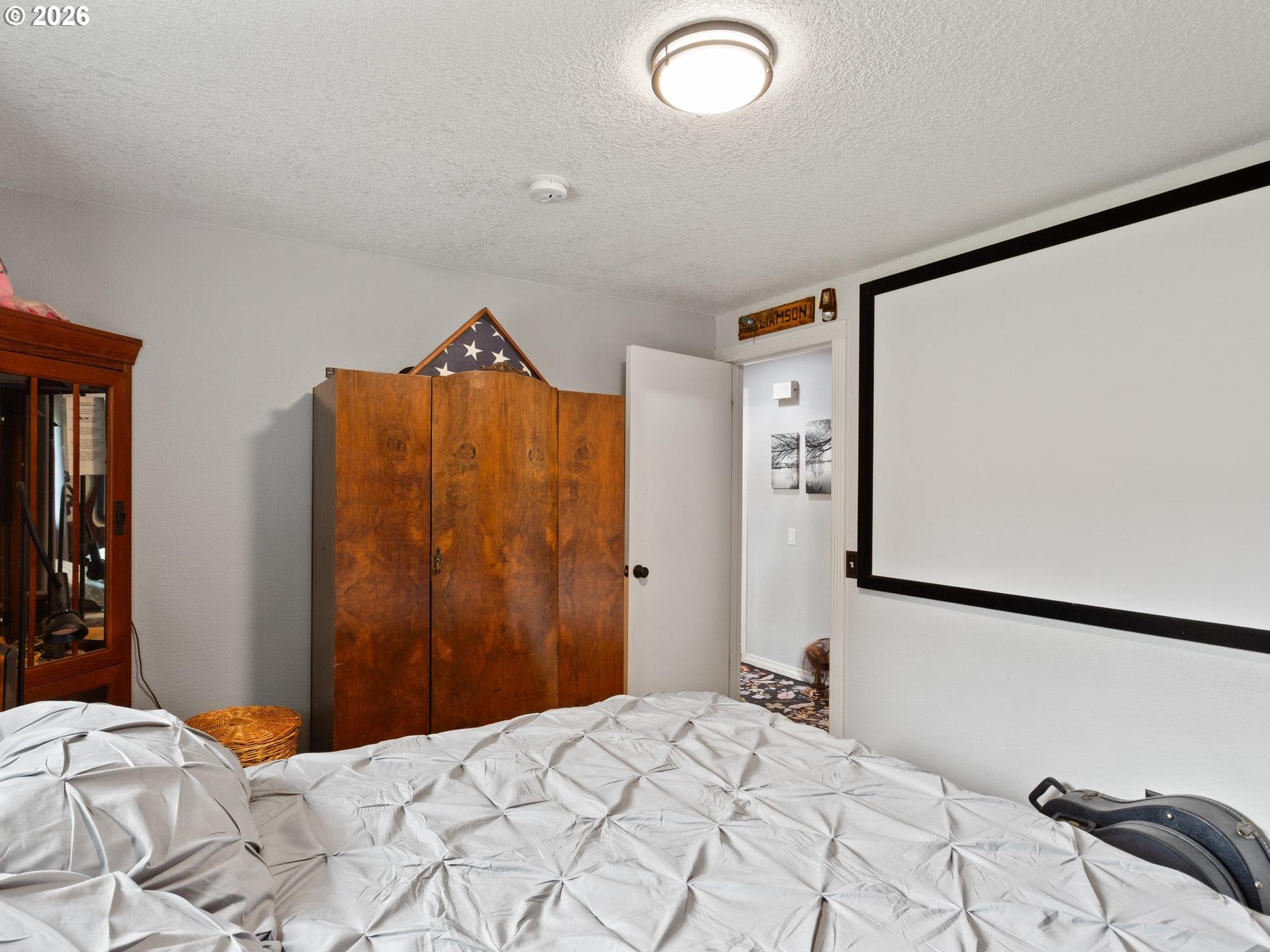 1719 Southwest 1st Street Battle Ground, WA 98604 - Photo 22 of 37 a bedroom with a bed and a large mirror