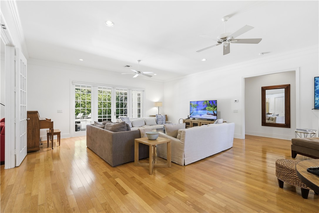 2116 Cavalla Road Vero Beach, FL 32963 - Photo 2 of 23 a living room with furniture and a flat screen tv