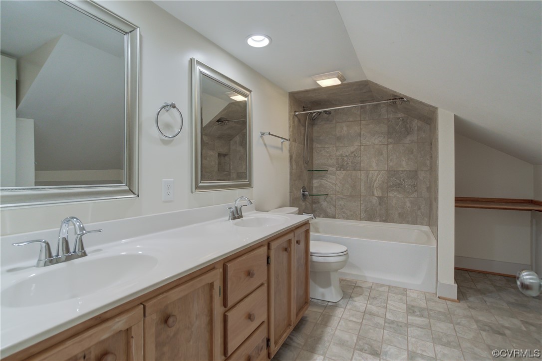 2567 Broad St Road Gum Spring, VA 23065 - Photo 23 of 38 a bathroom with a double vanity sink toilet mirror and bathtub