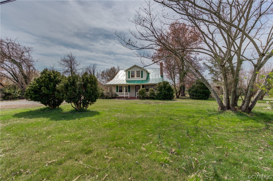 2567 Broad St Road Gum Spring, VA 23065 - Photo 27 of 38 a front view of house with yard and green space