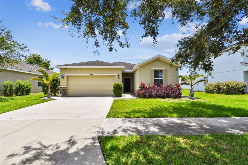 12221 Fairlawn Drive Riverview, FL 33579 - Photo 1 of 1 a front view of a house with garden