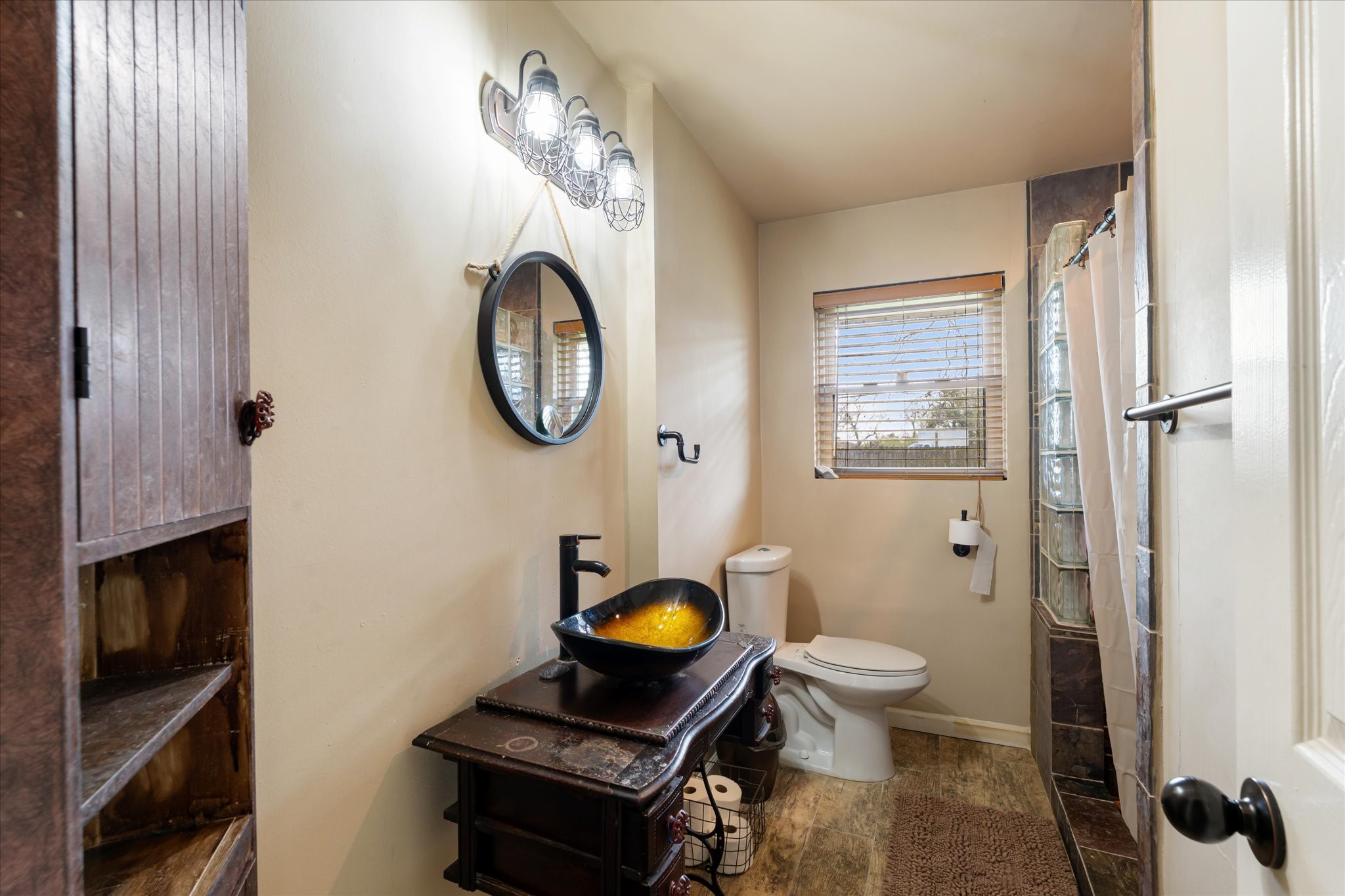 2423 Metz Street Houston, TX 77034 - Photo 14 of 22 a bathroom with a toilet and a mirror