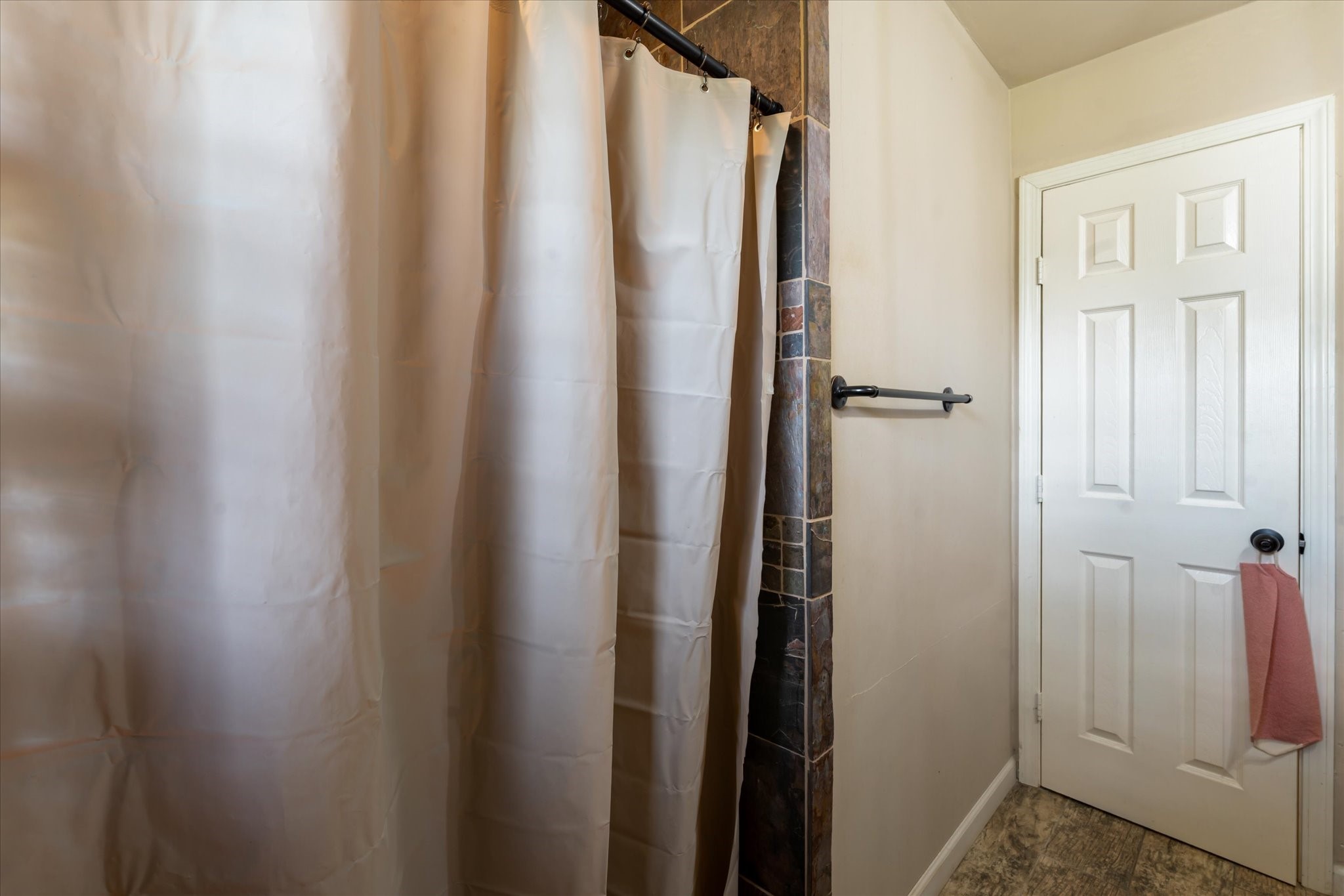 2423 Metz Street Houston, TX 77034 - Photo 15 of 22 a bathroom with a shower and a door