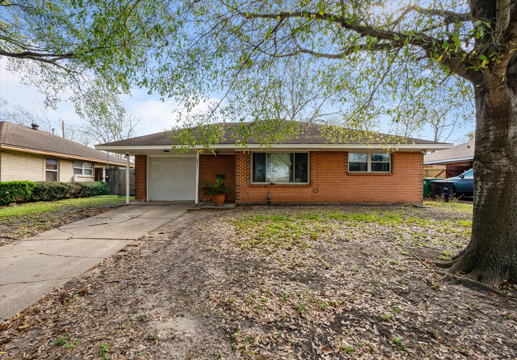 2423 Metz Street Houston, TX 77034 - Photo 2 of 22 a front view of a house with garden