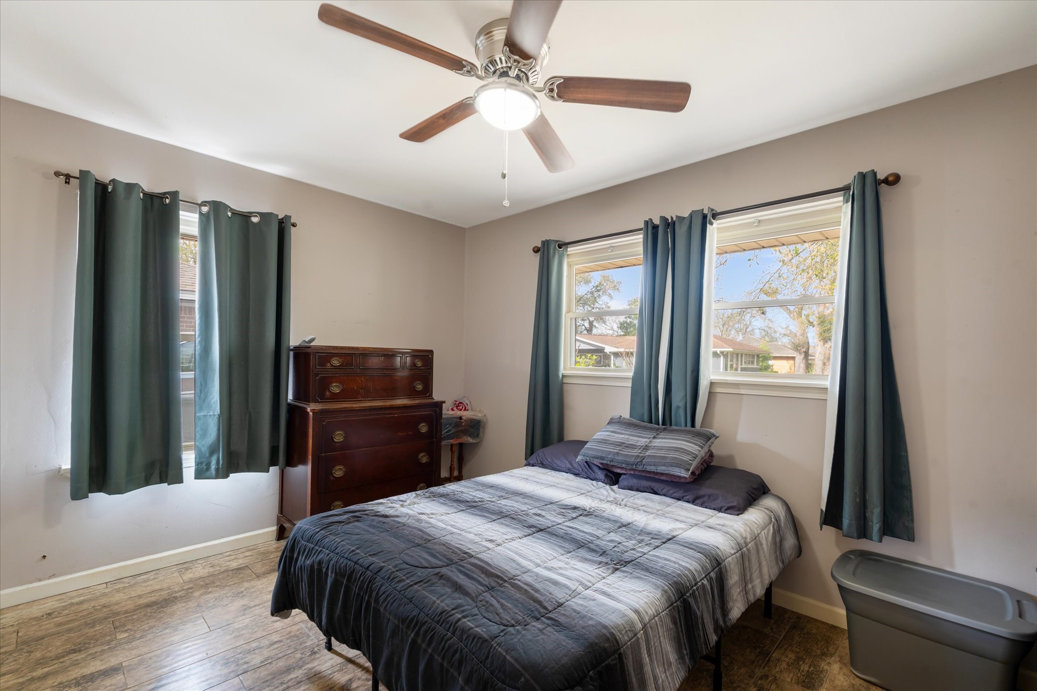 2423 Metz Street Houston, TX 77034 - Photo 6 of 22 a bedroom with a bed and a large mirror with wooden floor