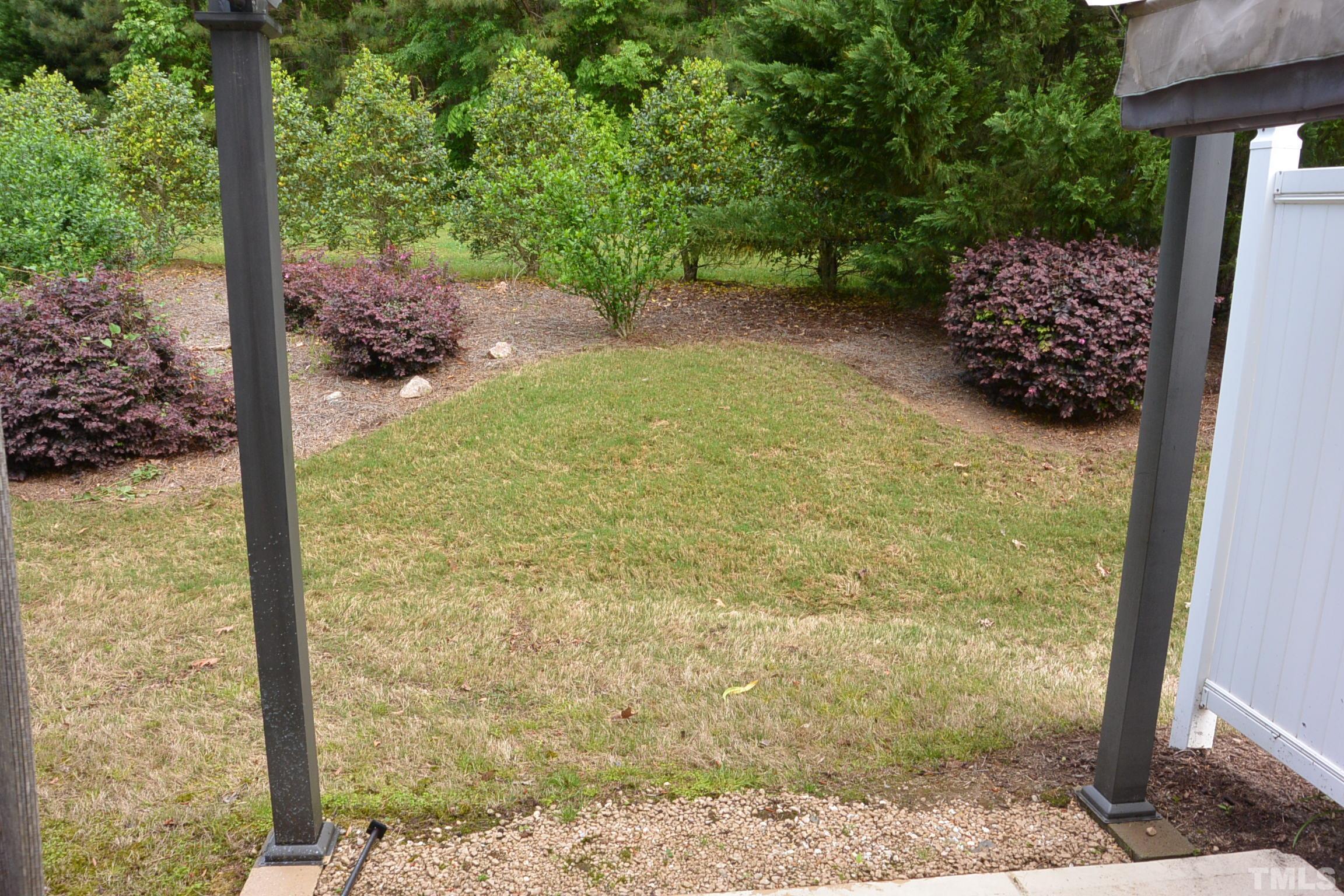 7052 Racine Way, Unit N/A Raleigh, NC 27615 - Photo 11 of 11 a view of a garden