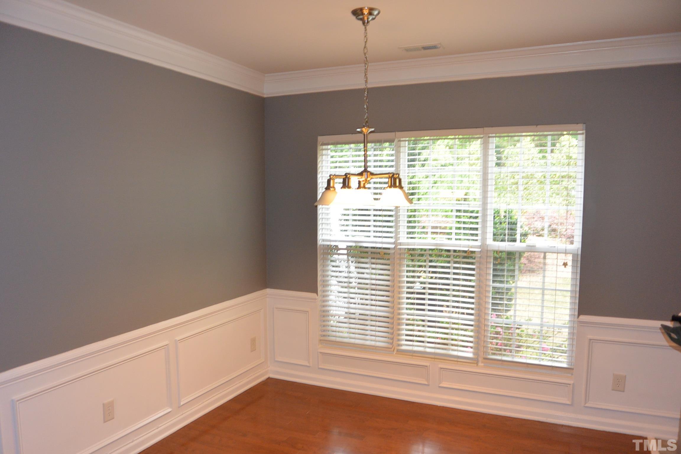 7052 Racine Way, Unit N/A Raleigh, NC 27615 - Photo 3 of 11 a view of an empty room with a window
