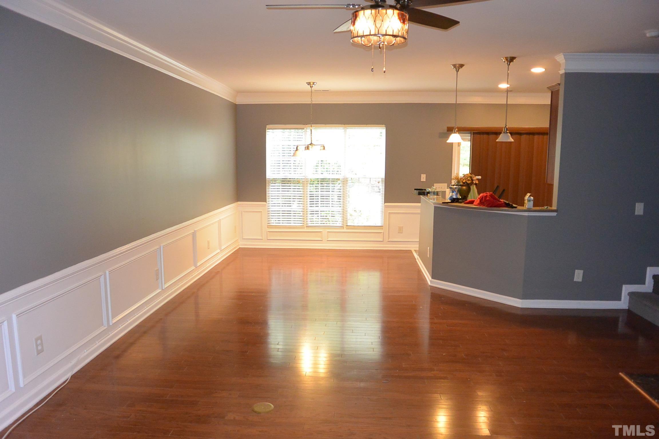 7052 Racine Way, Unit N/A Raleigh, NC 27615 - Photo 4 of 11 a view of a room with wooden floor and window