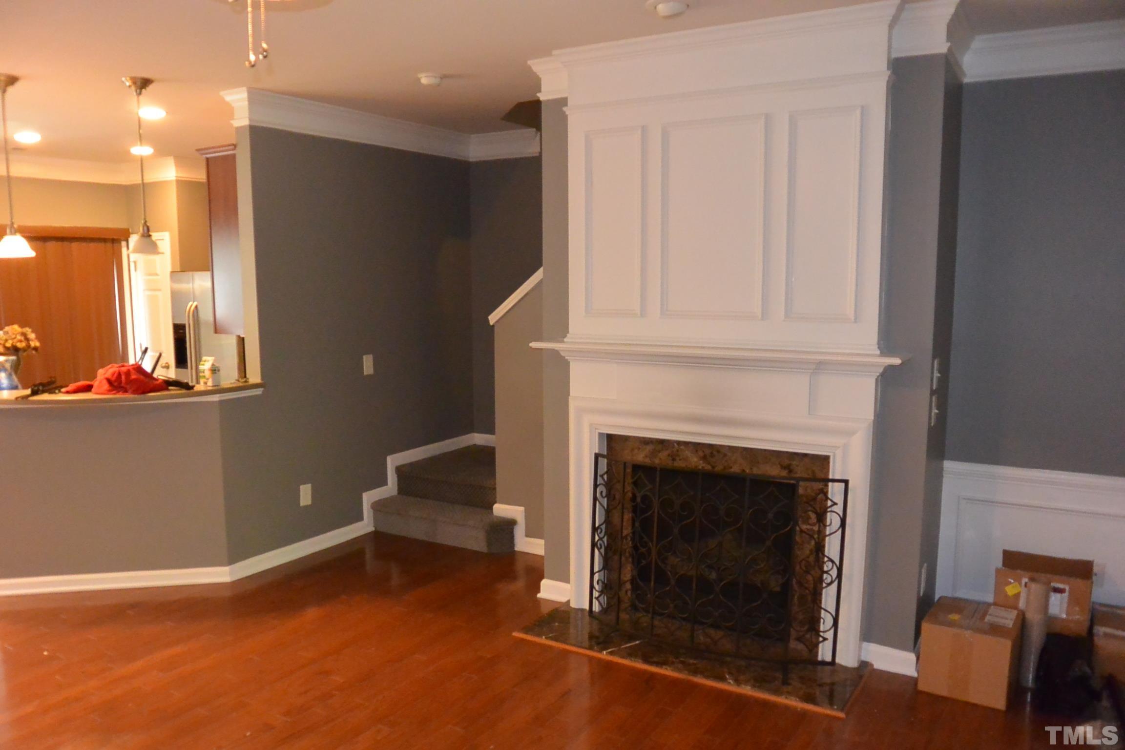 7052 Racine Way, Unit N/A Raleigh, NC 27615 - Photo 5 of 11 a living room with furniture and a fireplace