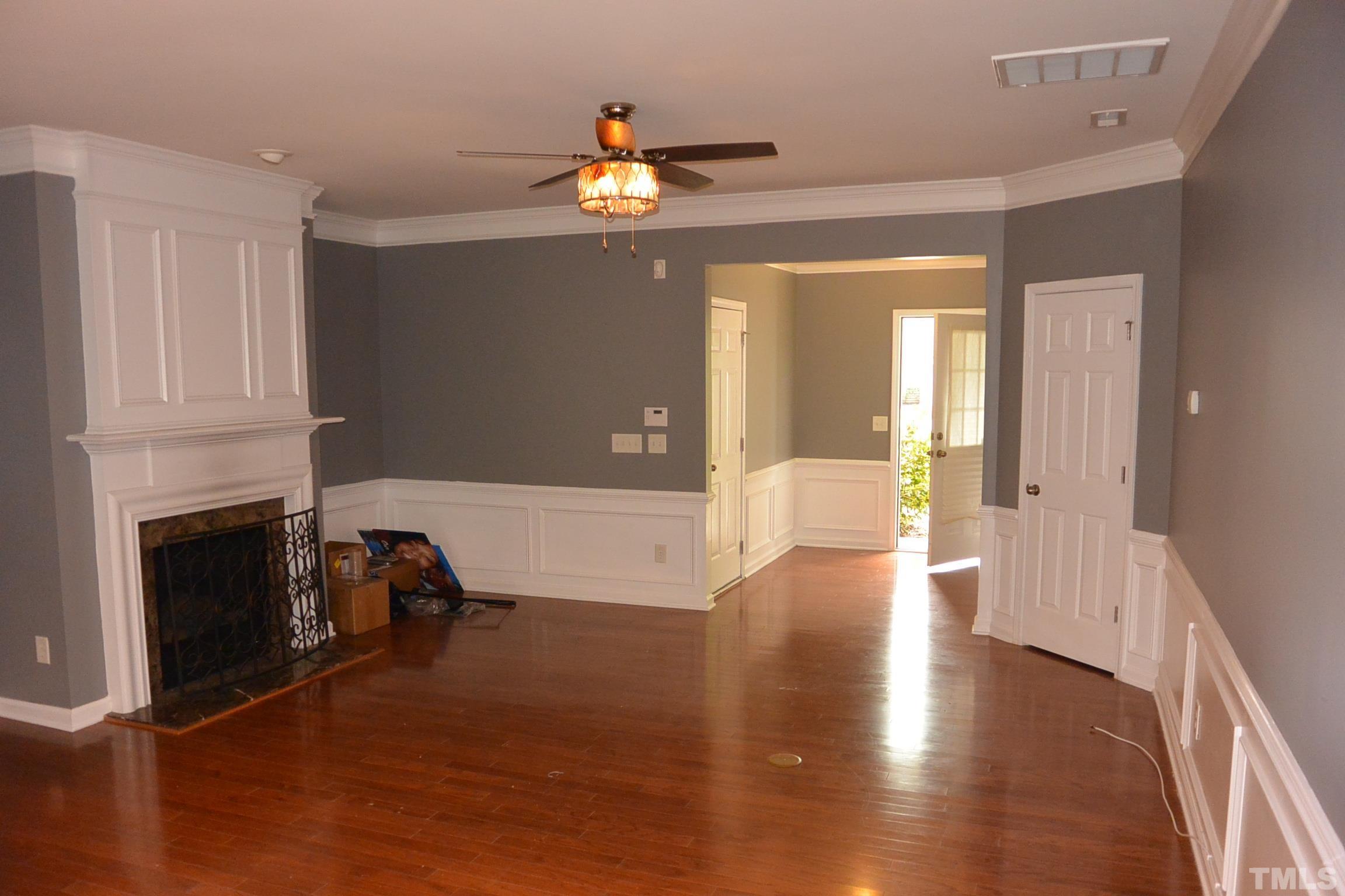 7052 Racine Way, Unit N/A Raleigh, NC 27615 - Photo 6 of 11 a view of livingroom with furniture and fireplace