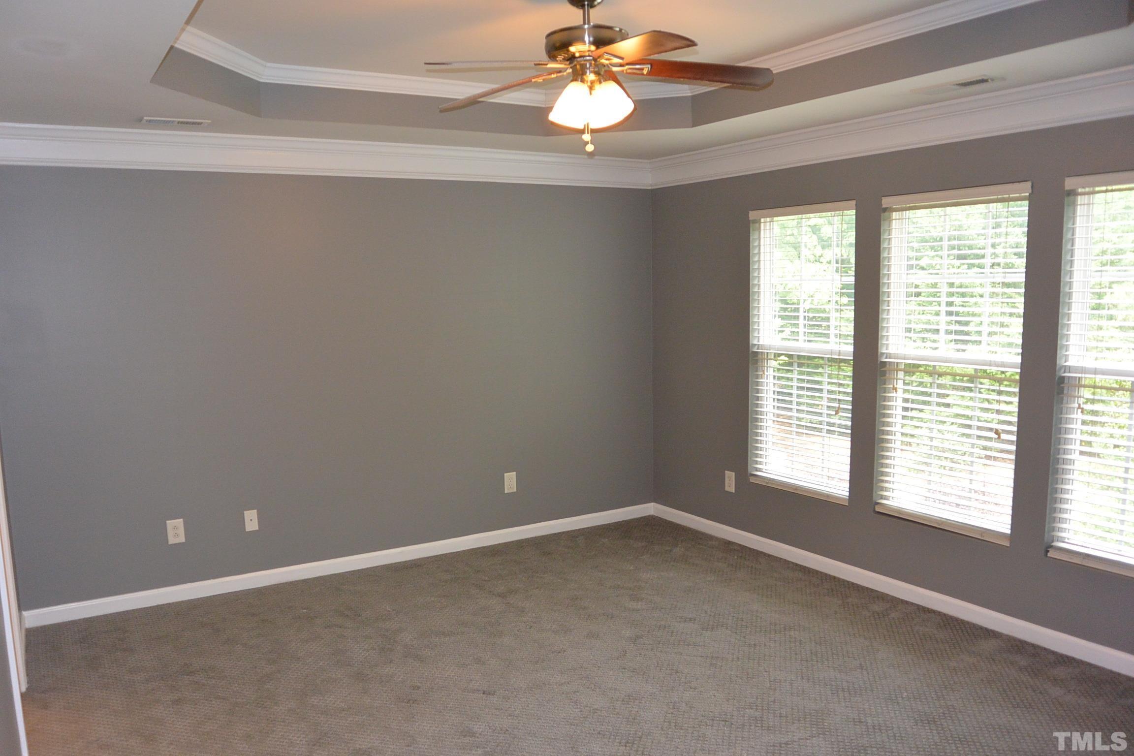 7052 Racine Way, Unit N/A Raleigh, NC 27615 - Photo 7 of 11 a view of an empty room with a window