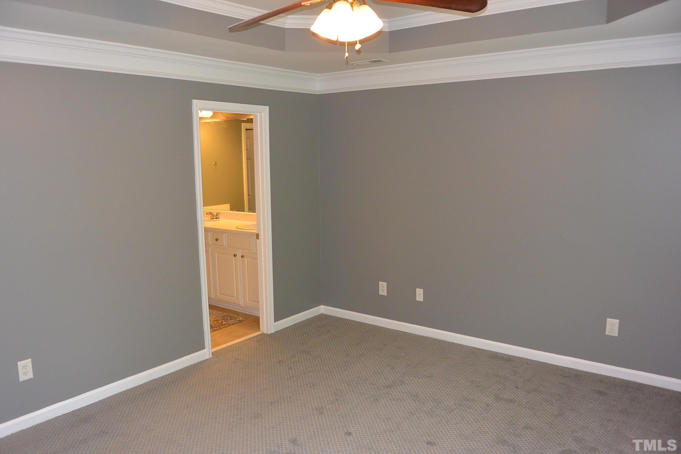 7052 Racine Way, Unit N/A Raleigh, NC 27615 - Photo 8 of 11 a view of an empty room with a window
