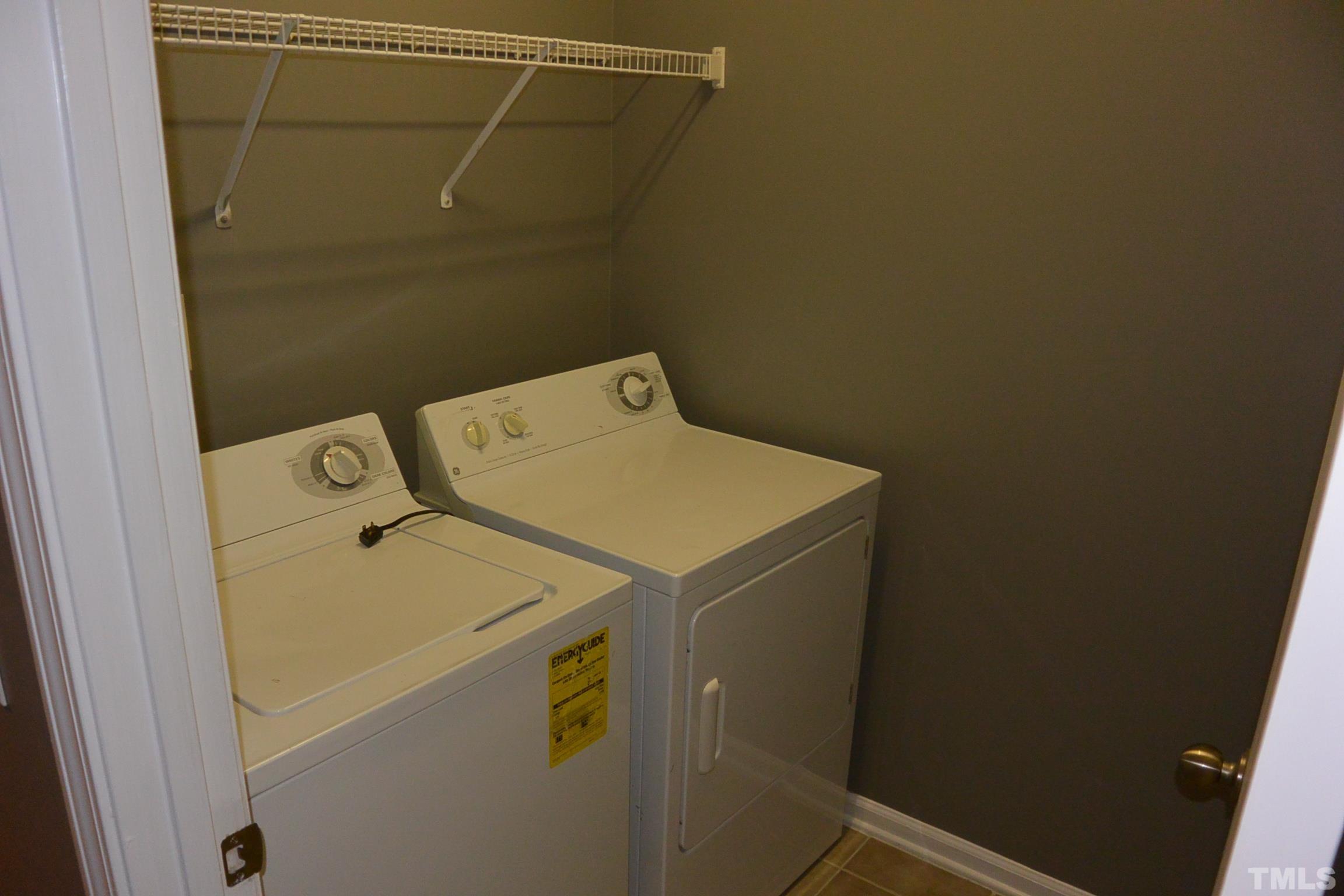 7052 Racine Way, Unit N/A Raleigh, NC 27615 - Photo 10 of 11 a utility room with dryer and washer