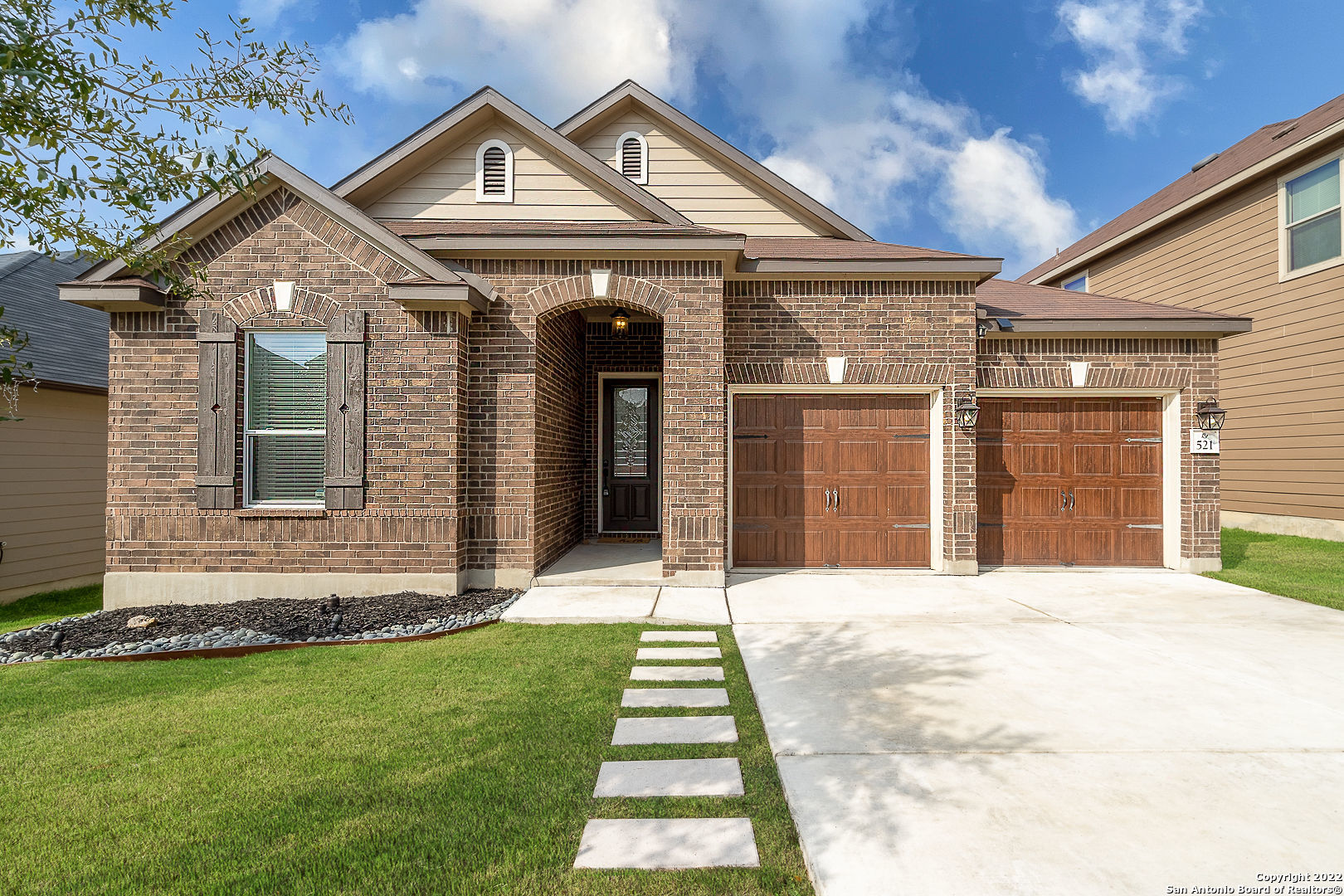 a front view of a house with a yard