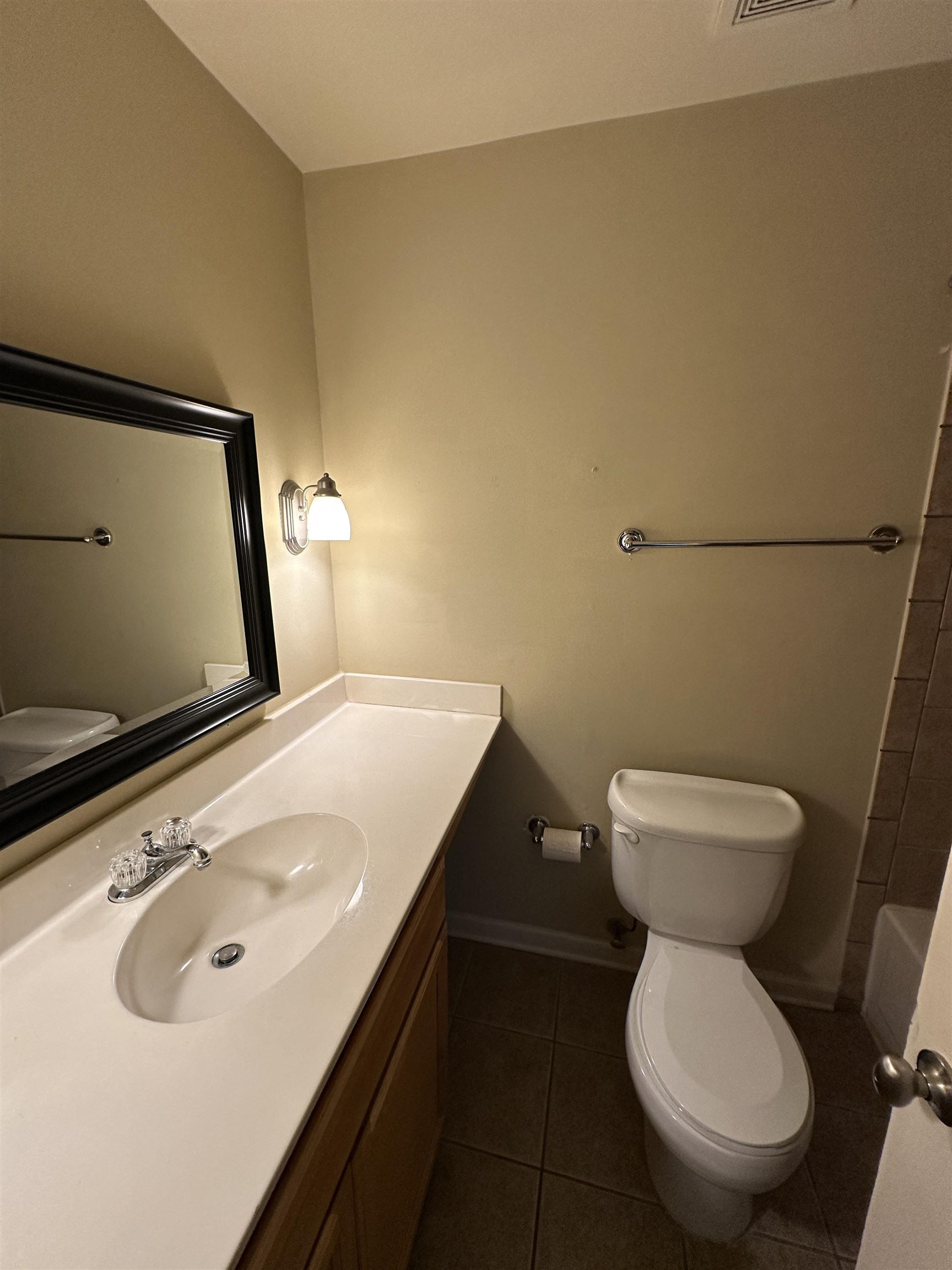 1837 Gray Ridge Cove, Unit 3 Germantown, TN 38138 - Photo 18 of 20 a bathroom with a toilet sink and mirror