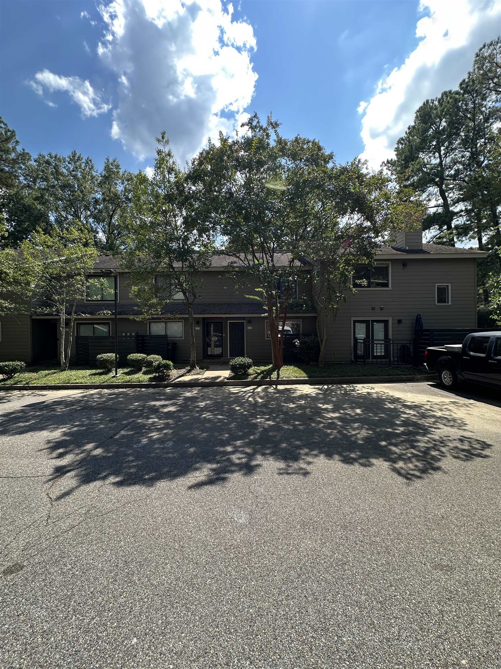 1837 Gray Ridge Cove, Unit 3 Germantown, TN 38138 - Photo 2 of 20 a front view of a house with a yard and garage
