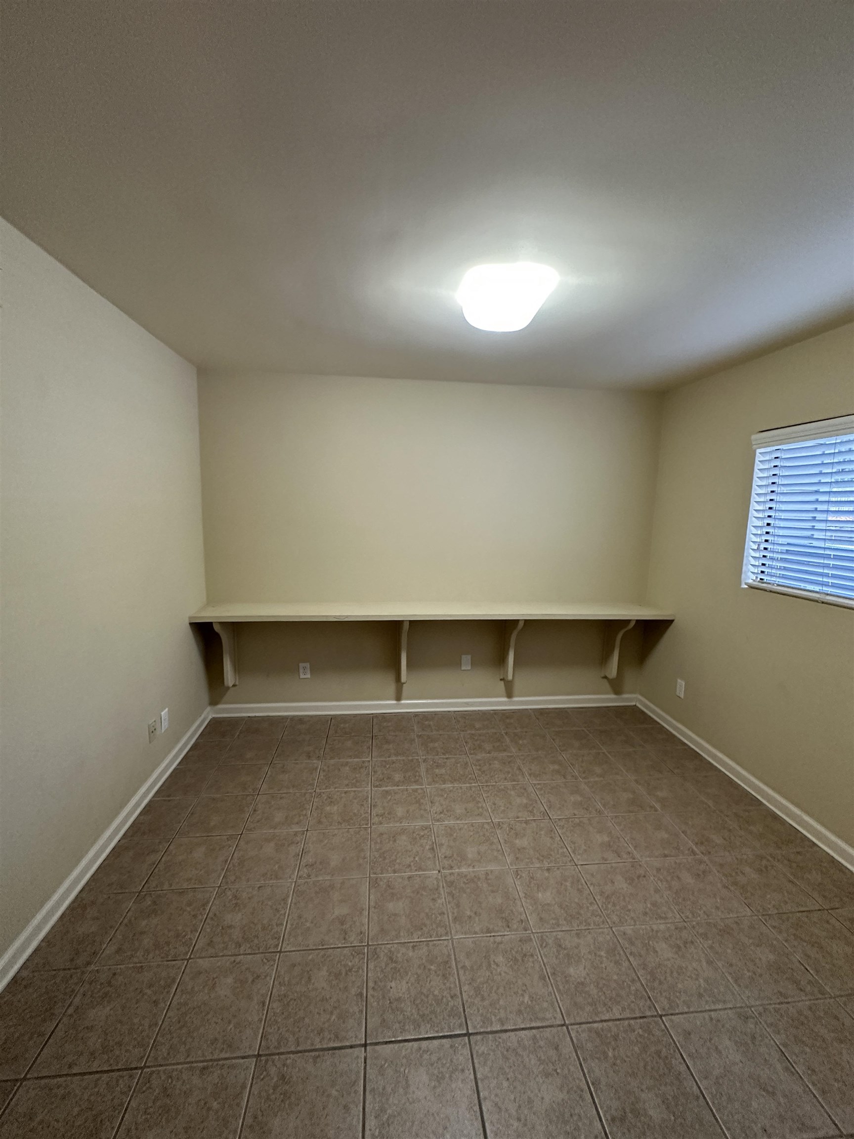 1837 Gray Ridge Cove, Unit 3 Germantown, TN 38138 - Photo 4 of 20 an empty room with a empty space and windows