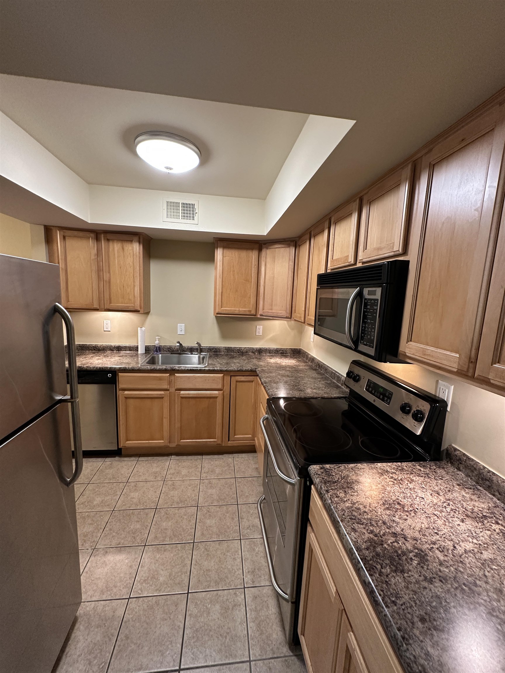 1837 Gray Ridge Cove, Unit 3 Germantown, TN 38138 - Photo 6 of 20 a kitchen with a stove sink and cabinets