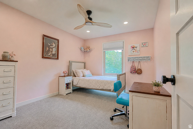 2924 Robidoux Road Sandy, UT 84093 - Photo 37 of 68 Recessed lighting, wood-finish ceiling fan, window with roller shade, paneled door with black hardware, and wall-to-wall carpeting