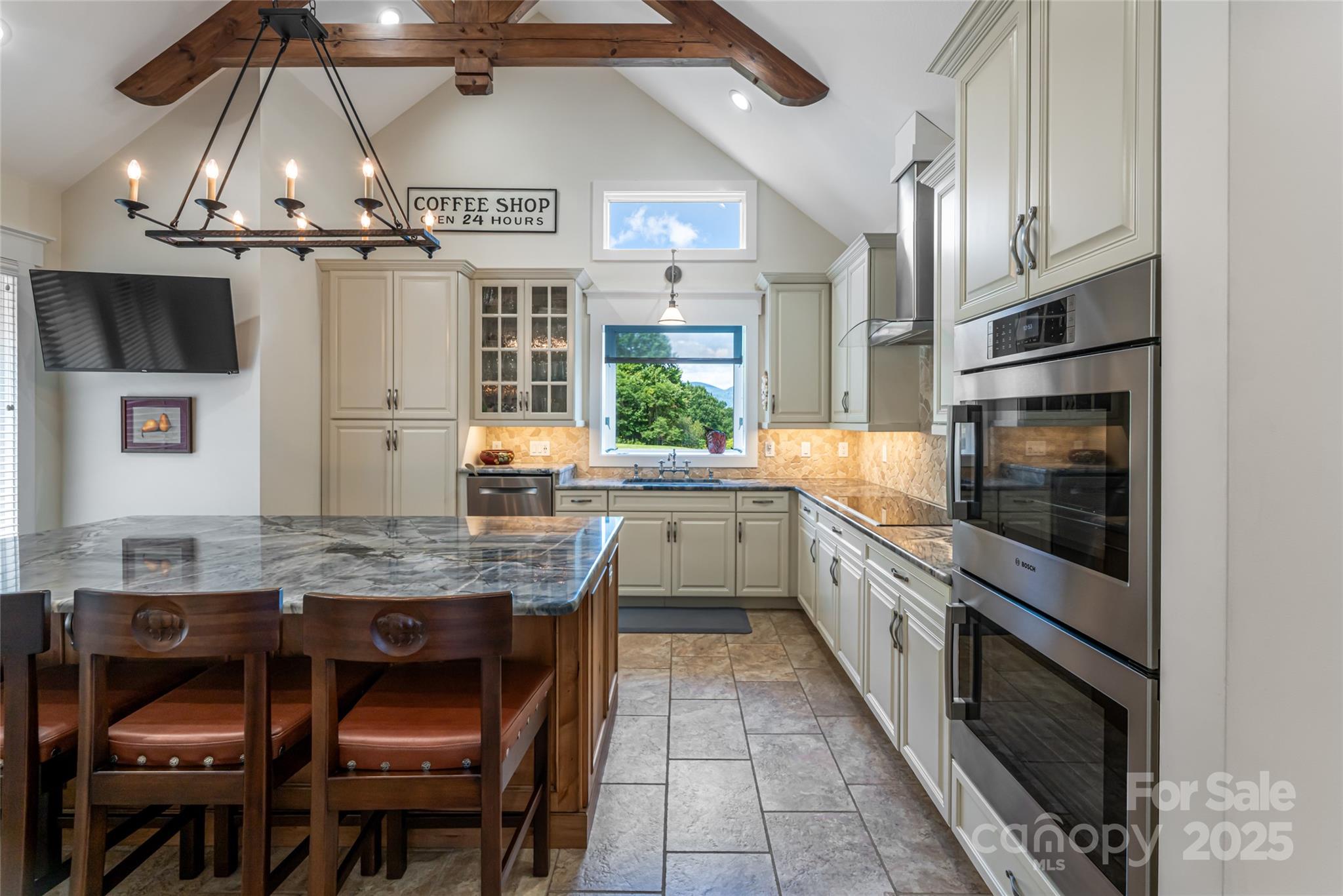 208 Parrish Farm Road Waynesville, NC 28786 - Photo 14 of 48 a kitchen with cabinets and window