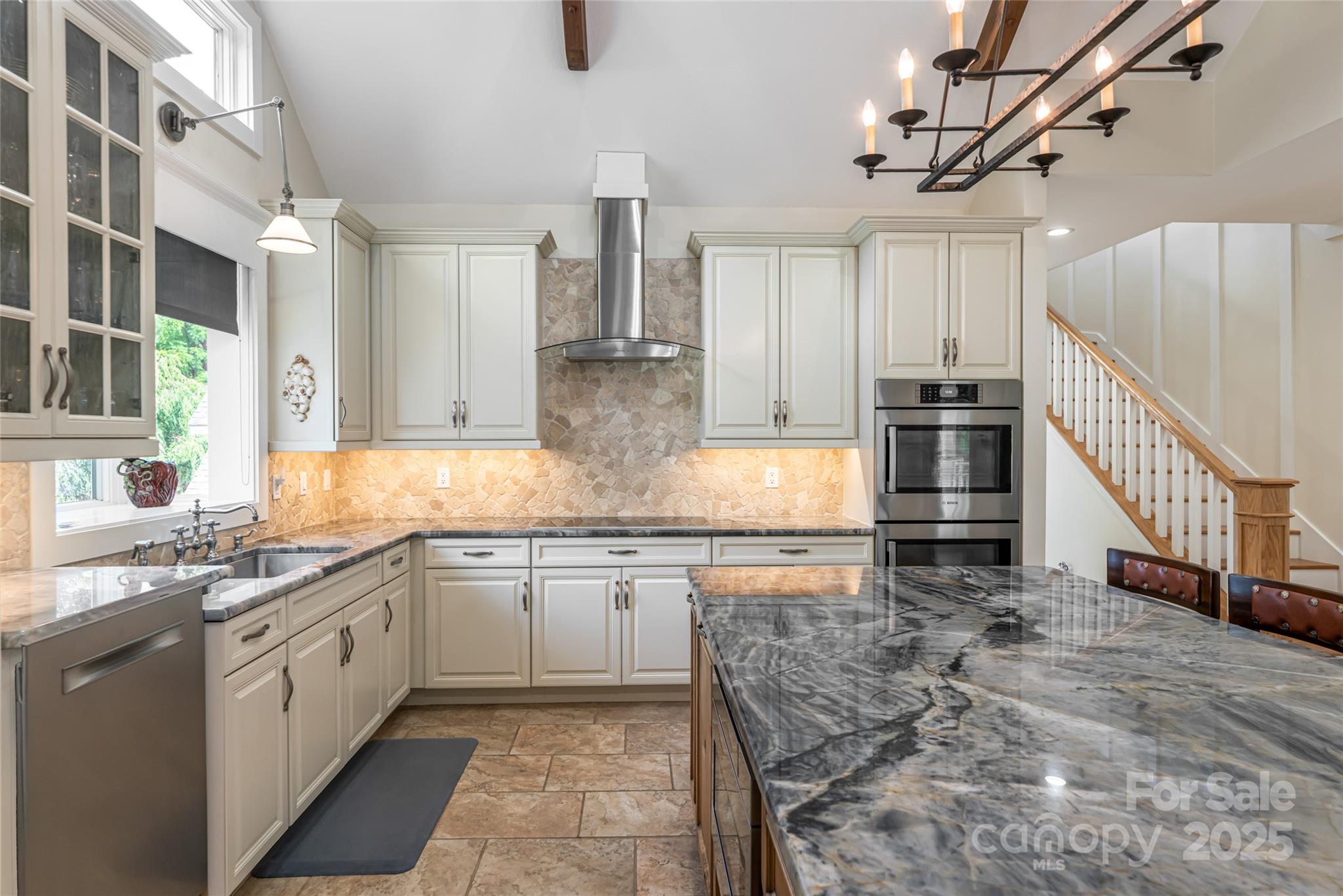 208 Parrish Farm Road Waynesville, NC 28786 - Photo 15 of 48 a kitchen with stainless steel appliances kitchen island granite countertop a sink a stove top oven and cabinets